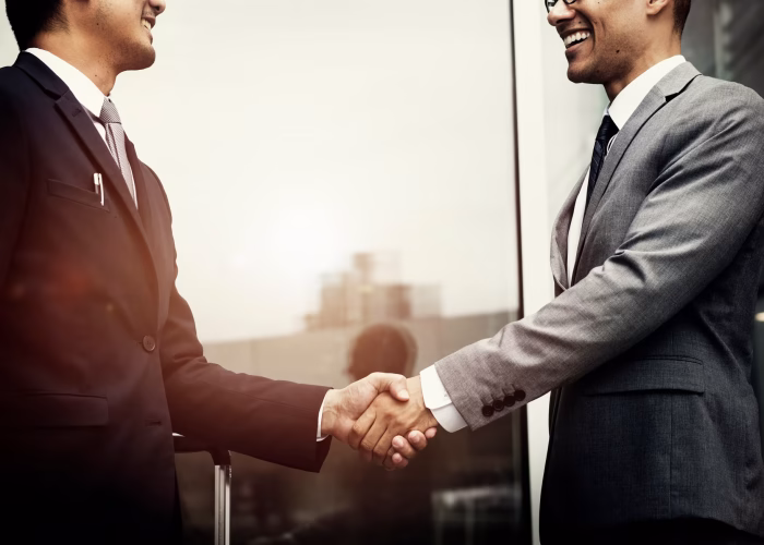 businessmen-shaking-hands_53876-31495